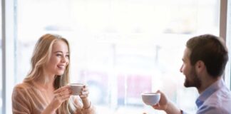 Man and woman talking at cafe flirty questions to ask a girl