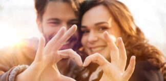 Couple making a heart with their hands tips for dating an introvert