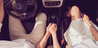 Couple holding hands while using cute car date ideas