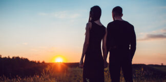 Couple looking at sunset how to fall back in love