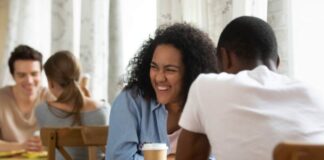 couple on date at a restaurant smiling