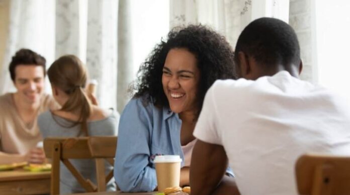 couple on date at a restaurant smiling