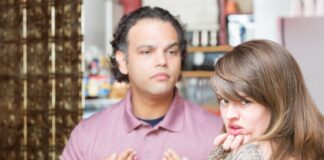 woman with tattoo having a coffee with boyfriend