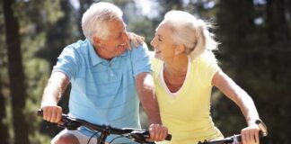 happy matured couple biking