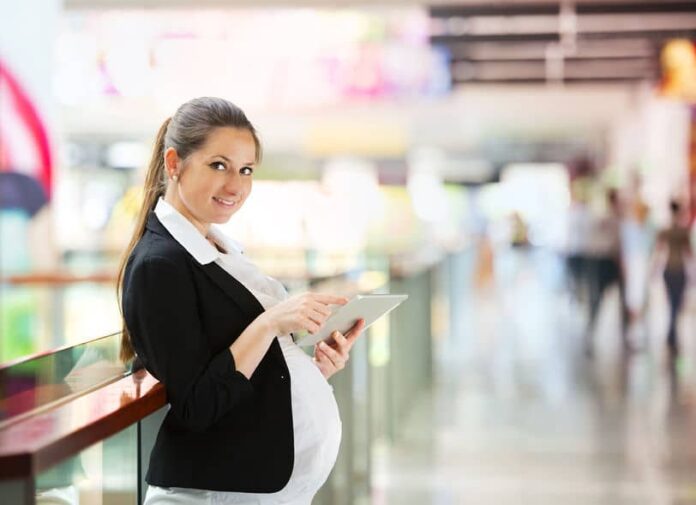 Pregnant woman using a tablet