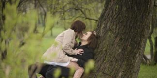 men and woman at the park having an intimate moment