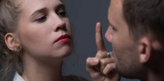 angry woman with red lipstick pointing to his boyfriend