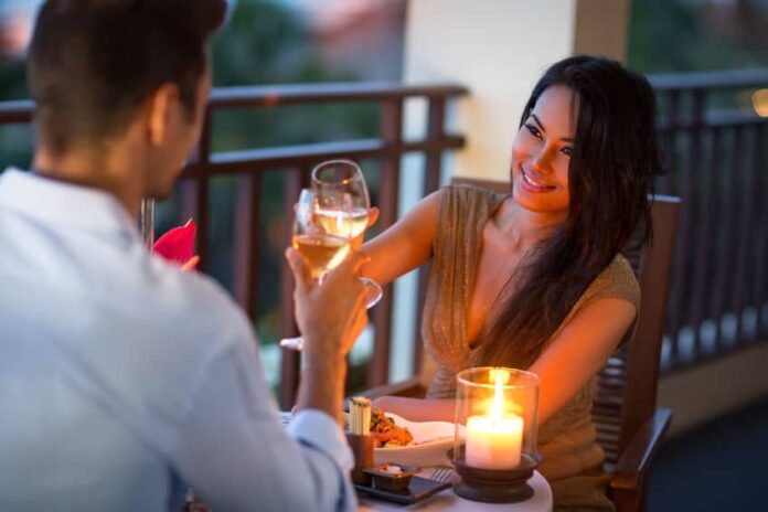 perfect couple having a date night with candles and wine