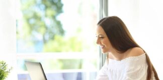 woman writing a perfect profile on her laptop