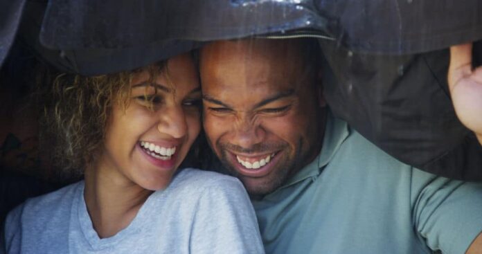 happy couple under the rain