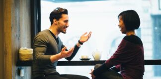 men and woman having a good conversation at a restaurant