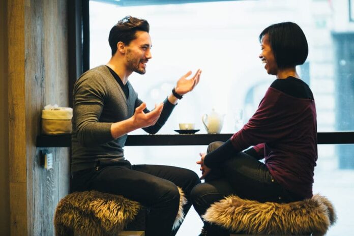 men and woman having a good conversation at a restaurant