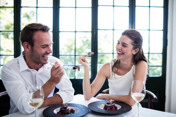 sweet couple laughing in a restaurant