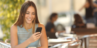 Girl Texting at Lunch Table