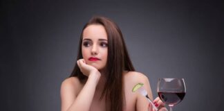 lady in red eating and drinking wine