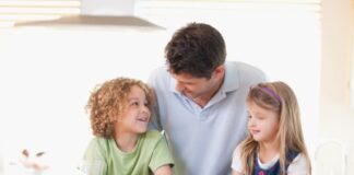 a father spending time with his children on the table