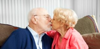 a 40-year-old married couple kissing