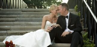 newly married couple sitting on the stairs