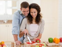 Handsome man cooking with his girlfriend