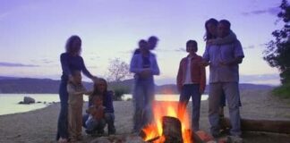 family having a camp fire