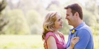 middle-aged couple looking at each other while embracing