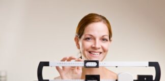 conscious woman checking her weight