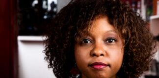 Pretty African American Woman in Bright Green Blouse