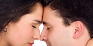 couple freaming together with eyes closed and facing each other