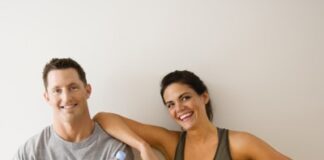 a guy and his female friend holding water bottles