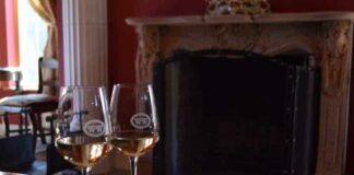 Two wine glasses on one of the most romantic getaways in Virginia
