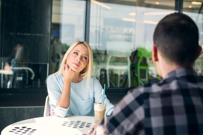 woman looking at her date, intently