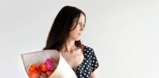 woman holding a bouquet of flowers