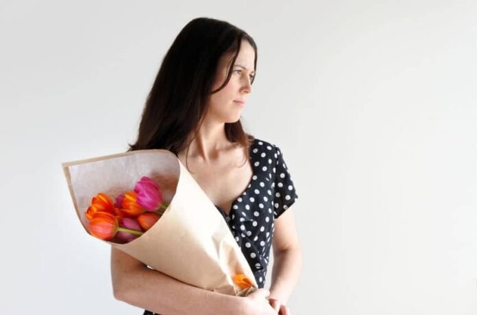 woman holding a bouquet of flowers