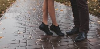 A pair of feet belong to a couple on rainy day date ideas