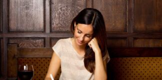 woman writing a checklist