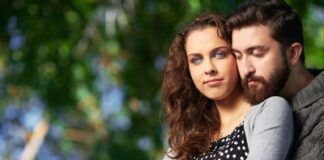 man embracing his woman from behind