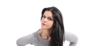 doubtful pretty woman wearing gray sleeves