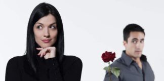 A man giving flower to a woman