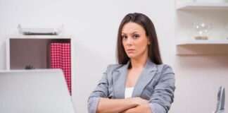 woman frowning in front of her laptop