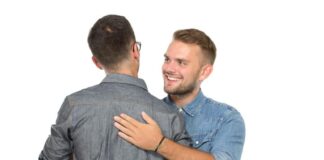 two men hugging each other