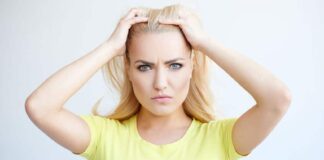 angry woman holding her hair back