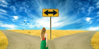 woman in between two different roads