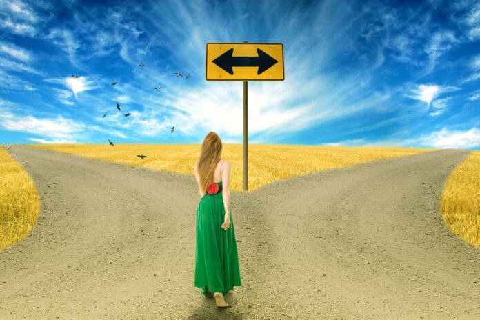 woman in between two different roads