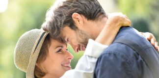 sweet young couple close together, forehead-to-forehead