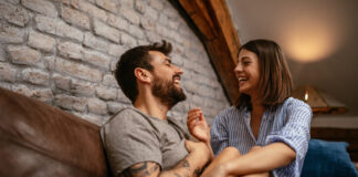 board games for couples header image - Cropped shot of a young happy couple relaxing at home