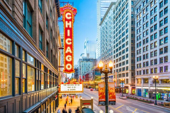 marquee of the historic Chicago Theatre - lit up at night - romantic things to do in Chicago