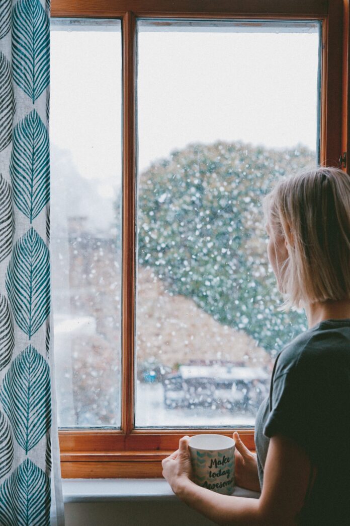 woman looking out of a window