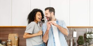 couple in kitchen smiling