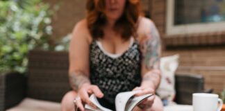 woman looking through notebook