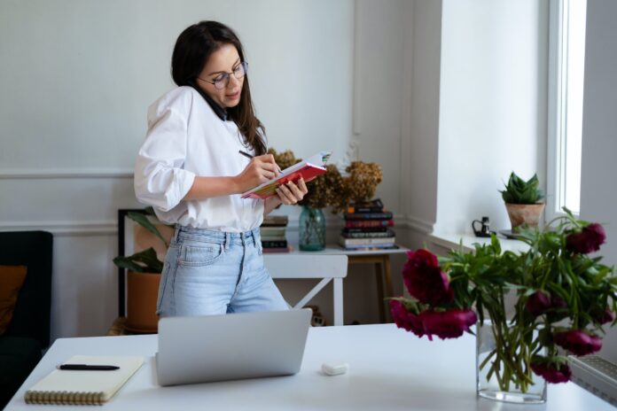 woman writing in a notebook